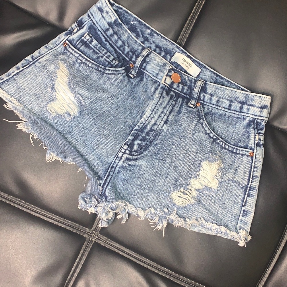 Distressed acid wash shorts in a size US 25.